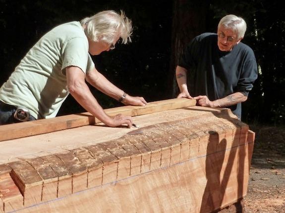 Bartow (right) worked with red cedar from the area for both sculptures.