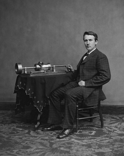 Thomas Edison poses with an early phonograph.
