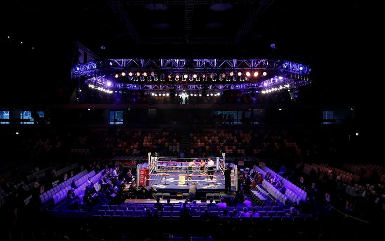 A boxing match takes place in London’s Copper Box Arena in 2013.