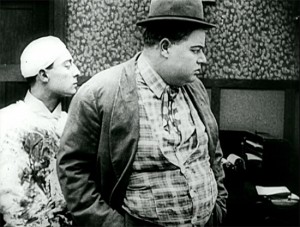 Buster Keaton as a doctor (note his blood-stained smock) and Arbuckle as prospective patient in Good Night, Nurse.