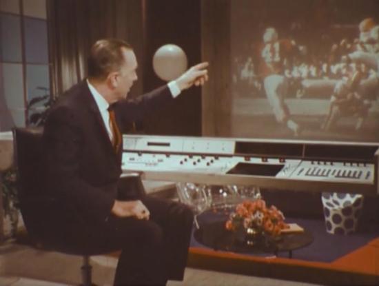 Walter Cronkite showing off the control panel