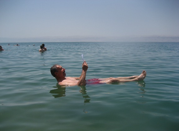 A man floats in the Dead Sea