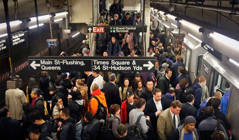 Commuters crowd a Grand Central subway station
