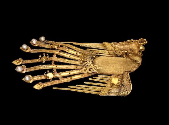 A gold and pearl hair ornament shows the long tradition of the phoenix motif in Chinese culture.