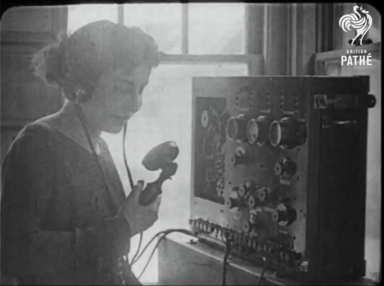 A woman speaking into a microphone